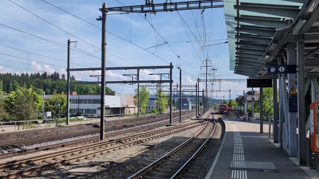 Train leaving the station in Switzerland, regional train platform