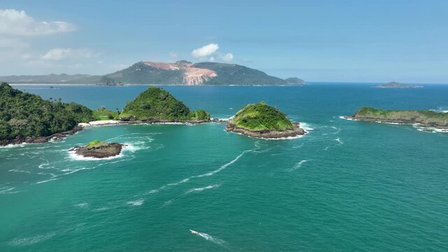 Aerial Pan of Green Islands Tropical Landscape and Turquoise Ocean Indonesia East Java