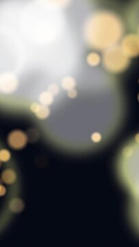 Vertical video: Warm dots appearing sparking bokeh cluster growing merging sinking forming mood