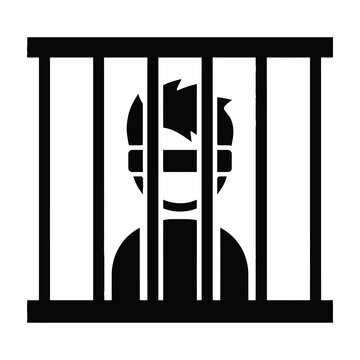 Prisoner behind bars with blindfold