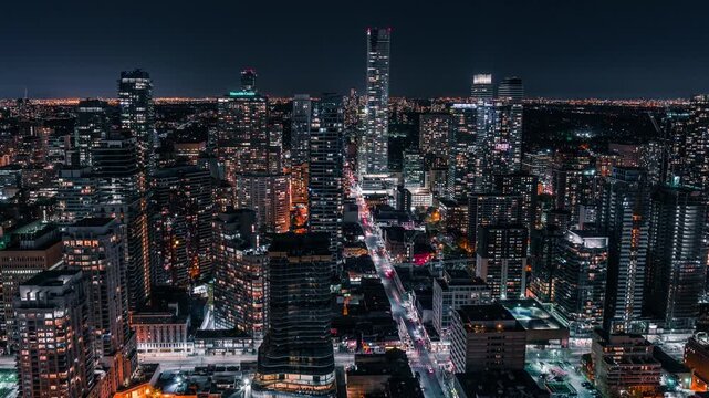 Stunning aerial hyperlapse captures vibrant city nightlife with bustling streets and glowing skyscrapers.