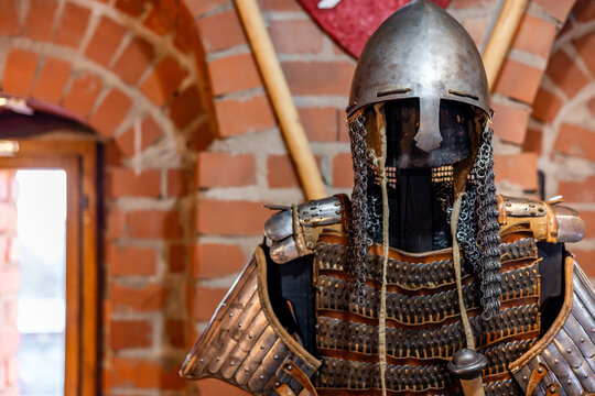 Closeup of a medieval knight's suit of armor and helmet. Close-up of knight's armor, Numerous breastplate and cuirass of a medieval knight.