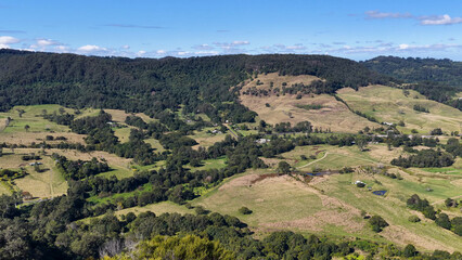 Fototapeta premium Panoramic Aerial View of Lush Green Hills and Rural Landscapes in Nimbin