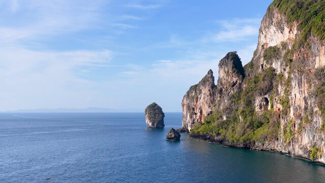 Aerial View of Towering Limestone Karst Cliffs and Turquoise Andaman Sea