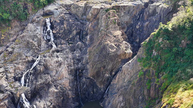 Aerial View of Barron River Falls Cascading Down Rugged Rocky Cliffs