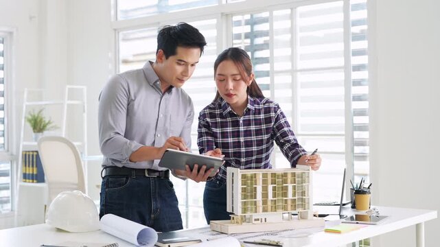 Architecture, design engineers, and architects converse in the office, demonstrating collaboration between civil engineering architect designer team in the workplace, brainstorming for a project.