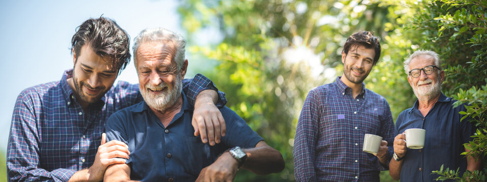 Adult hipster son and old senior father stay for work at home, two generations have a beard talking together and relaxing with smile, happy enjoy living to isolation quarantine at home, father's day