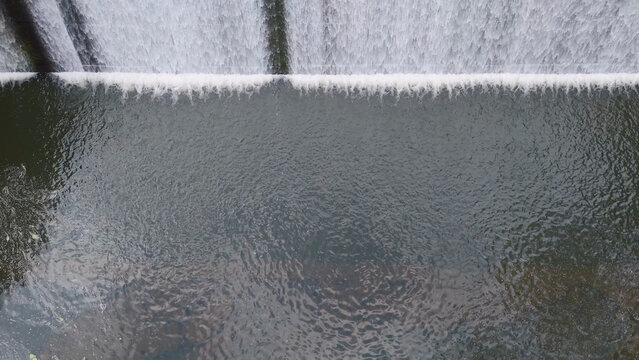Aerial View of Water Cascading Over a Dam in Gold Coast