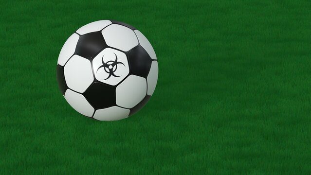 Soccer ball with biohazard symbol on green grass background