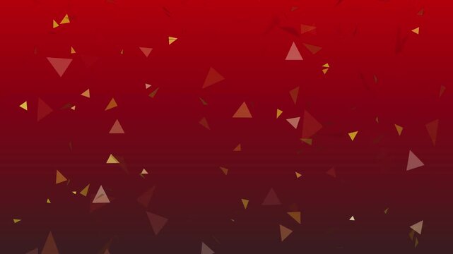 Abstract red background featuring golden triangular confetti particles falling in slow motion