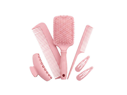 Collection of essential pink hair care tools, including a paddle brush, combs, and hair clips.