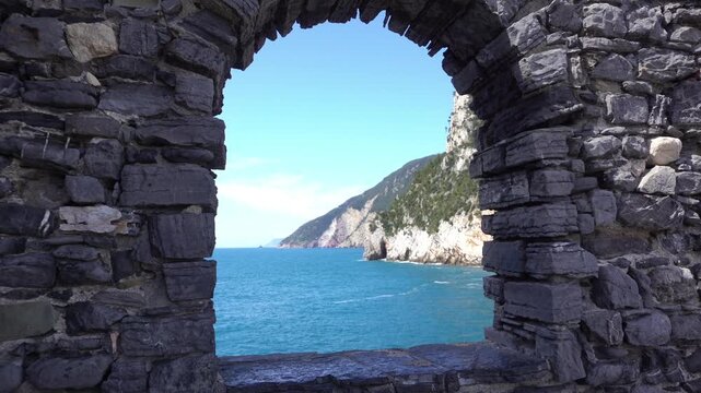 Italy, Liguria, The Church of San Pietro in Portovenere in the province of La Spezia, perched on a rocky spur overlooking the sea, is a Gothic-Genoese jewel from the 13th century - drone view 