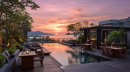 Fototapeta premium Luxury rooftop terrace at resort hotel in Phuket Thailand with infinity pool, tropical palm trees, ocean view, sunny day