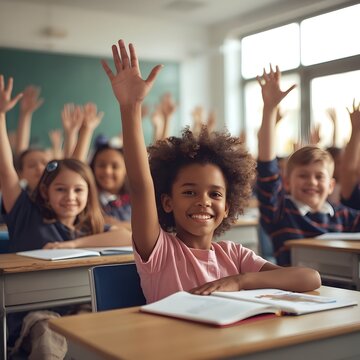 Children raising hands in classroom