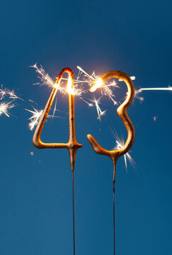 43 years celebration festive background made with Bengal fires in the form of number Forty three. Vertical photography.