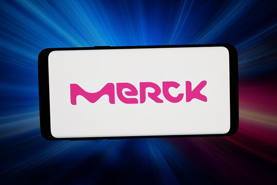 Stuttgart, Germany - 05-06-2026: In this photo illustration, the logo of German chemical and pharma company Merck KGaA is displayed on a smartphone in front of abstract background on computer screen.