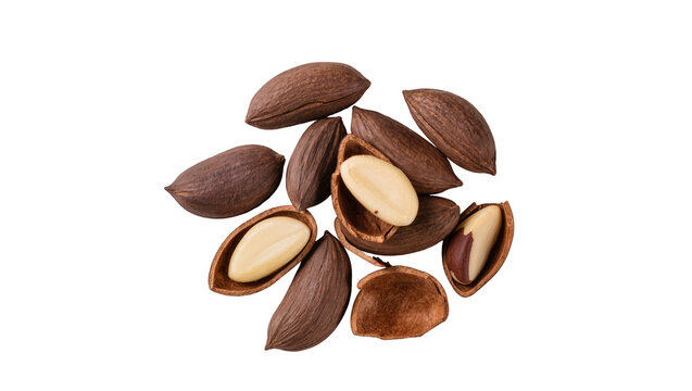 Pile of whole and cracked pili nuts with creamy white kernels, isolated on transparent background
