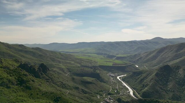 Aerial drone video of the natural surroundings near Akhtala Monastery in Armenia. Mountainous landscapes, forests, hills, and rural scenery of Lori Province captured from above in northern Armenia.