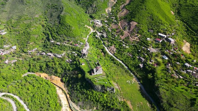 Aerial drone video of Akhtala Monastery and its surrounding landscape in Lori Province, Armenia. Historic medieval monastery complex surrounded by mountains, forests, and rural scenery in Armenia.