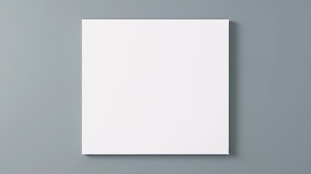 Blank white canvas on gray wall.