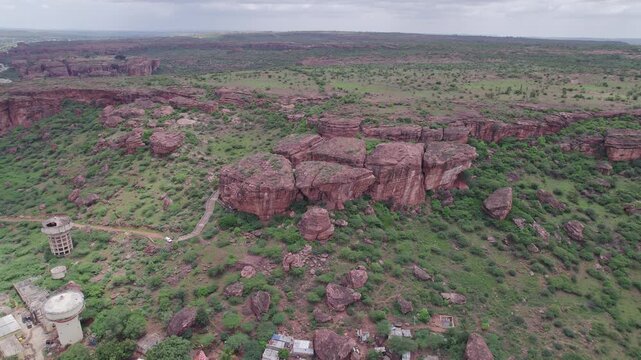 High angle shot of Badami Caves and surrounding terrain with rocky landscape
