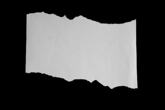 Close up of a white ripped or torn piece of paper with copy space.