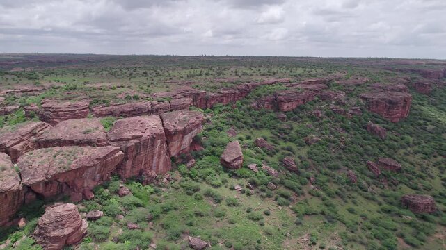 Pan shot of Badami Caves and surrounding terrain with rocky landscape