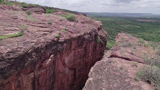 Top view of Badami Caves with rocky formations and natural terrain under open sky
