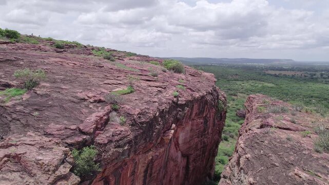 Top view of Badami Caves with rocky formations and natural terrain under open sky