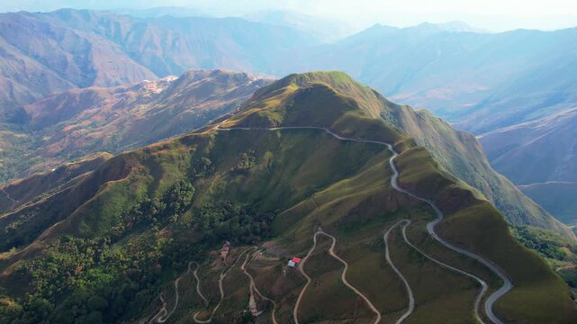 Aerial view of green tropical mountains with winding road, Aragua State, Venezuela