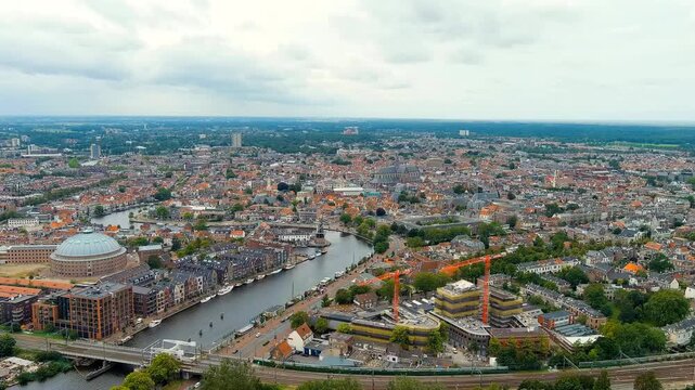 Haarlem, Netherlands. Panoramic view of Haarlem city center. Cloudy weather during the day. Summer. Drone footage