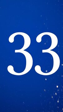 Gold Glitter Blow‑Away Reveal of Number 33 on Solid Background