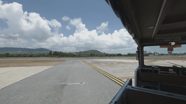 Riding the small bus to the plane at Koh Samui airport, Thailand
