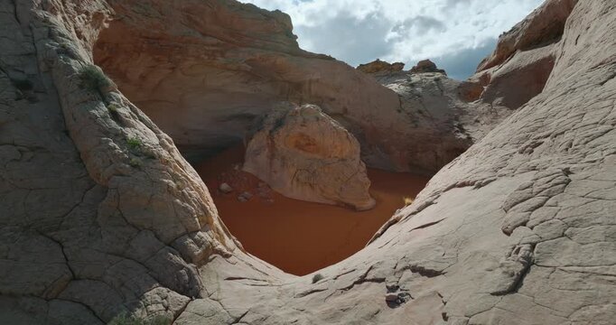 Cosmic Ashtray, Utah, White sandstone basin surrounding rust colored sand pool