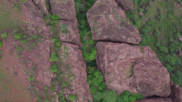 Bird&rsquo;s Eye View of historic Badami Caves with natural terrain and rugged rocky formations