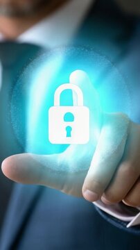 A businessman interacting with a digital lock symbol, showcasing the importance of cybersecurity and data protection in a modern, technology-driven world through a futuristic interface.
