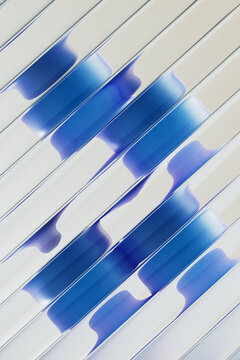 3D blue strip network with diagonal spacing on pale surface