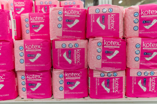 Villa de Alvarez, Colima. Mexico. April 14, 2026: Stacks of Kotex Pink Sanitary Pads Packaging on Store Shelf Display for Feminine Hygiene