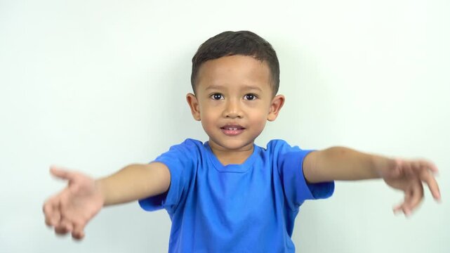 cute and funny little asian boy waving his hands making hand gestures to say good bye saying goodbye, greeting see you next time,