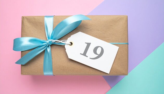 Nicely wrapped birthday present. Paper label with number 19 on it