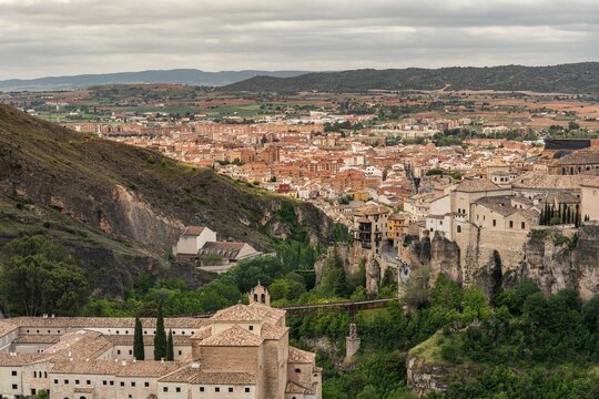 Panoramic view of the historic city of Cuenca Spain featuring the famous Hanging Houses and San Pablo Bridge over the Huecar gorge UNESCO World Heritage site