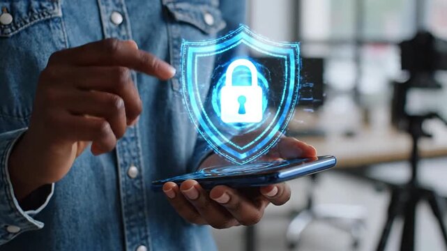 Person holding a smartphone displaying a digital security shield icon, representing online protection, data privacy, and robust cybersecurity for safe internet browsing and secure mobile transactions.