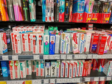 Belarus, Rechitsa - 12 May 2026 : A diverse range of toothbrush arranged on a supermarket shelf, showcasing various brands and product types.