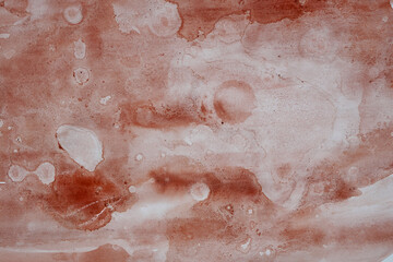 Fototapeta premium Abstract watercolor texture with soft earthy pink and beige tones.
