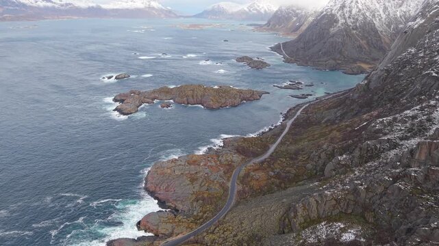 Exploring rocky coastline near islands in Norway during cloudy weather