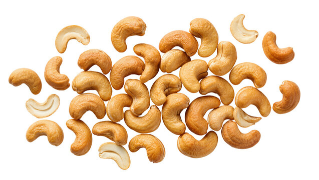 Heap of roasted cashew nuts some halved, isolated on transparent background