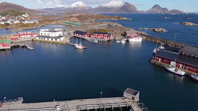 Exploring a small fishing village by the water in Norway on a clear sunny day