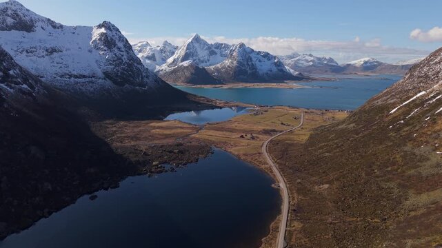 Stunning views from a drone over mountains and lakes in Norway during sunny day hours