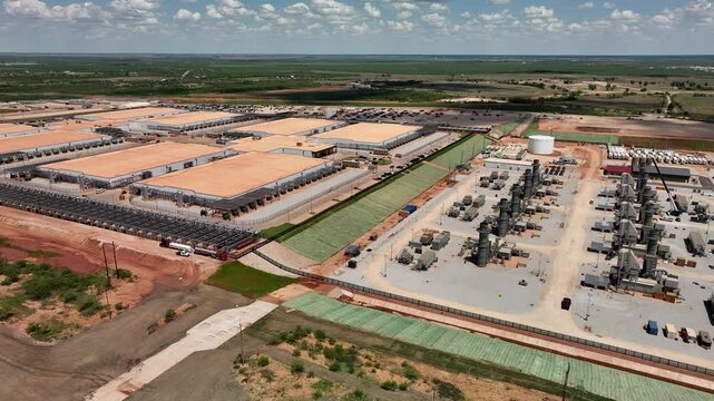 4K aerial drone video of the Stargate data center construction site in Abilene, Texas, showing AI infrastructure, site preparation, graded land, access roads, and construction progress.