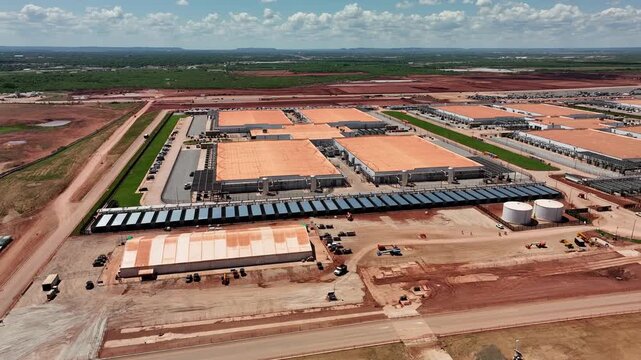 4K aerial drone video of the Stargate data center construction site in Abilene, Texas, showing AI infrastructure, site preparation, graded land, access roads, and construction progress.